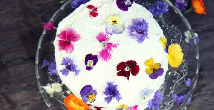 Walnut cake decorated with edible flowers