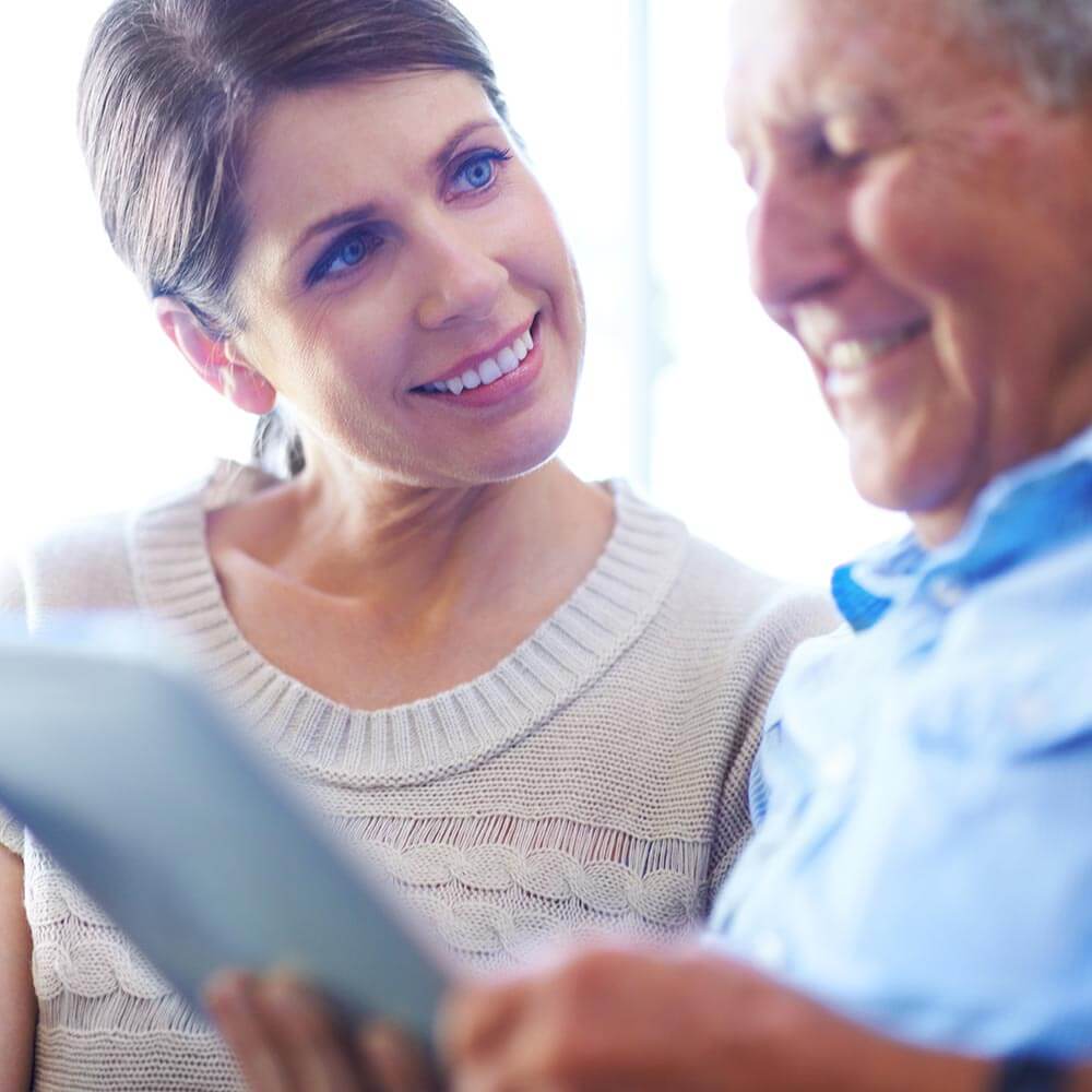 Client and carer looking at a card