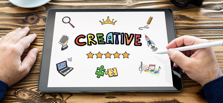 A tablet with 'creative' text