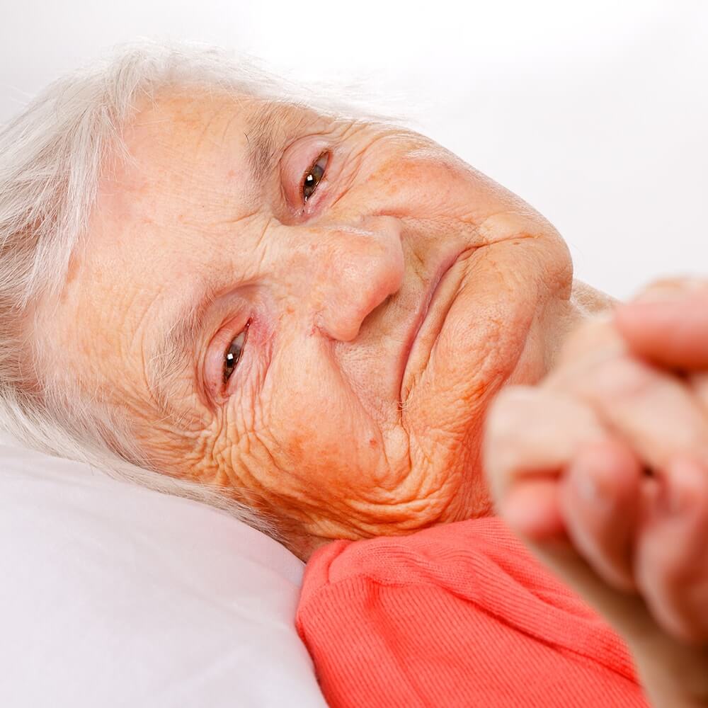 Elderly woman laying down